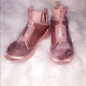 Rose gold pumas.